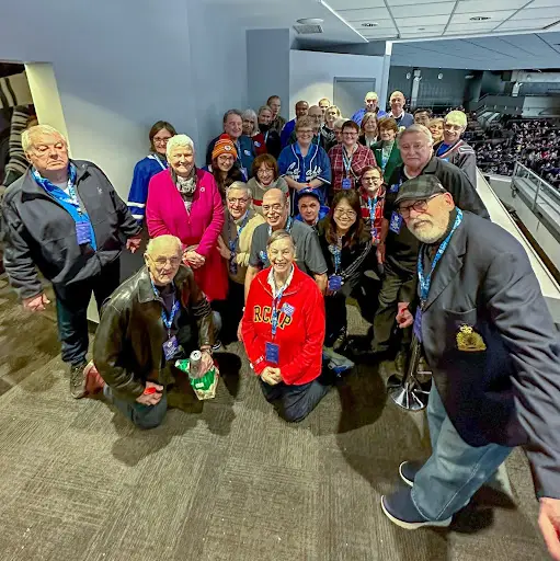 Victoria Division Vets visiting with a fellow Veteran at a Victoria seniors' residence on Remembrance Day 2024